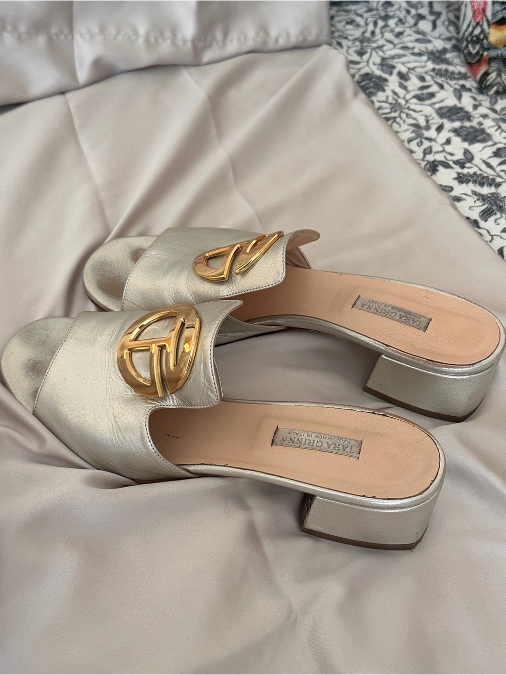 Metallic Gold Slide Mules with Decorative Emblem